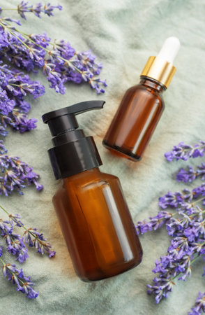 Lavender spa. Lavender  natural essential oil and fresh lavender on a textile background.の写真素材