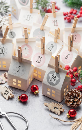 Preparation of christmas advent calendar. Advent calendar, Christmas gifts and decorations on a concrete background.の写真素材
