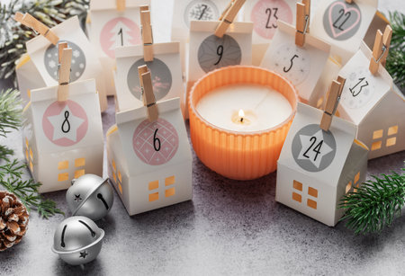 Preparation of christmas advent calendar. Advent calendar, Christmas gifts and decorations on a concrete background.の写真素材