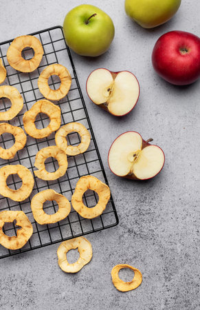 Dried apple chips. Dehydrated apples. Homemade dried organic apple sliced.