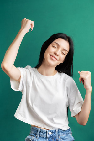 Portrait of a young teenager girl who rejoices in success.