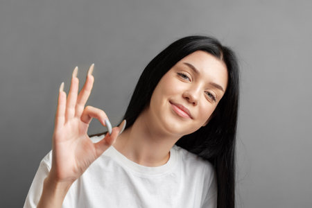 Portrait of a young teenager girl who rejoices in success.