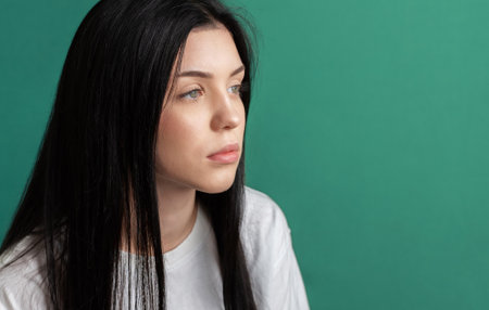 Portrait of a young teenager girl who looks sad.の写真素材