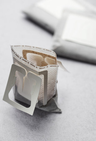 Drip coffee paper bags on a grey concrete backgroundの写真素材