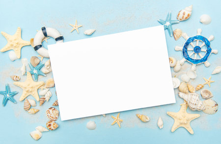 Blank card with starfish and seashells on a blue backgroundの写真素材