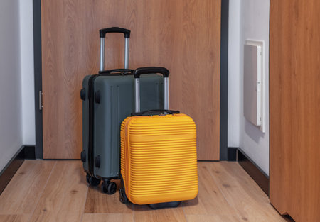 Two modern suitcases anticipating a journey for holiday or business departureの写真素材