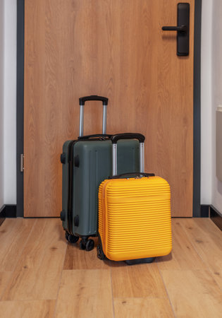 Two modern suitcases anticipating a journey for holiday or business departureの写真素材