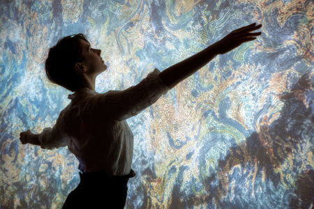 Woman's silhouette with arms extended, set against a colorful psychedelic backdrop filled with swirling patterns and textures, creating a captivating visual experienceの素材