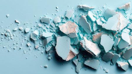 Photography of scattered pastel blue flakes on a soft background, beautifully illuminated by diffused light, evoking a calm and serene ambianceの素材