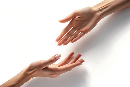 Two hands reaching out to each other isolated on white backgroundの素材