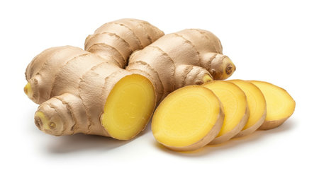 Fresh ginger root and slices isolated on a white background. A healthy spice and herb, perfect for cooking, alternative medicine, and promoting wellness and nutrition.の素材