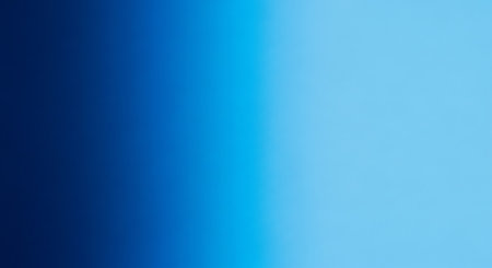 A smooth blue gradient background with a soft transition between light and dark shades, ideal for creating a modern and clean design. Perfect for web design.の素材