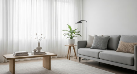 Modern living room interior with sofa and coffee table near window. Home interior with comfortable sofa, stylish decor and sunlight. Interior design concept.の素材