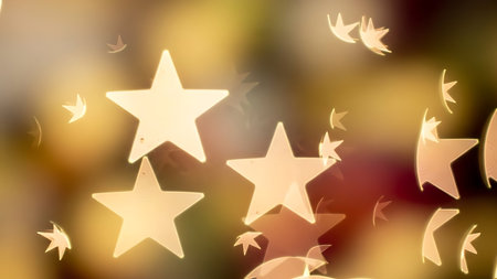 Softly glowing golden star shaped bokeh lights creating a magical and dreamy festive backgroundの素材