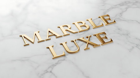 Elegant gold lettering spelling marble luxe placed on a white marble surfaceの素材