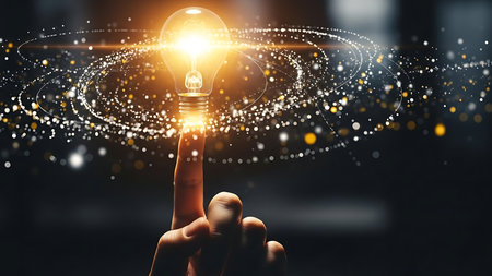 Hand of businessman touching with finger glowing light bulb. Idea and innovation conceptの素材