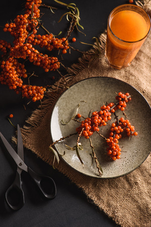 Sea buckthorn fresh autumn beverage in a glassの写真素材