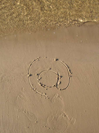 Sandy beach with symbol e-mailの写真素材