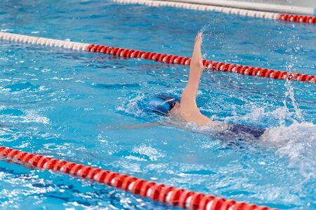 Swimming pool athlete training indoors.の写真素材