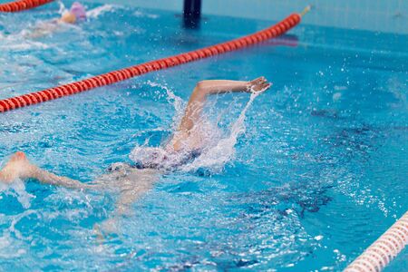 Swimming pool athlete training indoors.の写真素材