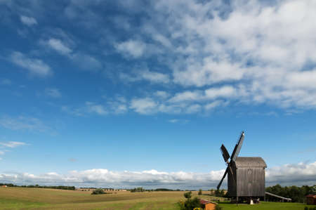 Old wooden windmill near Storkow in Mecklenburg-Vorpommern, Germany. This kind of windmill is calling の写真素材