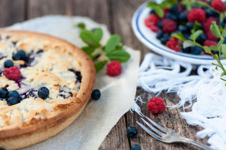 Blueberry cake with fresh blueberries and raspberriesの写真素材
