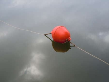 Floating bouy on lake surfaceの写真素材