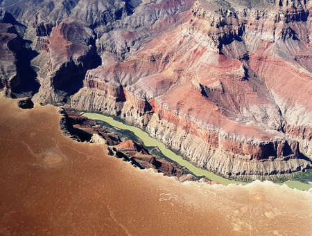 Flying over Colorado river down in grand canyonの写真素材