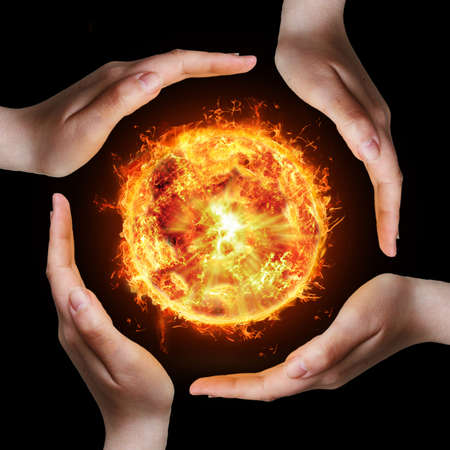 hands and fireの写真素材