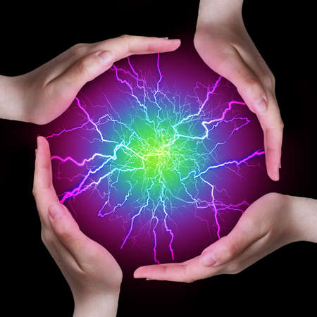 Hands and lightningsの写真素材