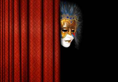mask behind theater curtainsの写真素材