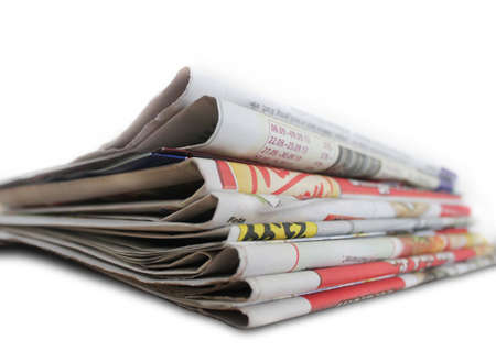 Newspapers on a white backgroundの写真素材
