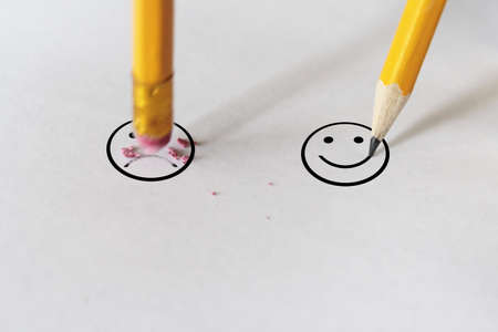 sadness to happiness wit pencil eraserの写真素材