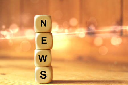 Wooden dice with the word newsの写真素材