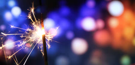 sparkler with colorful bokeh background