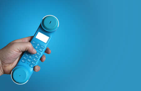 Telephone receiver in male handの写真素材