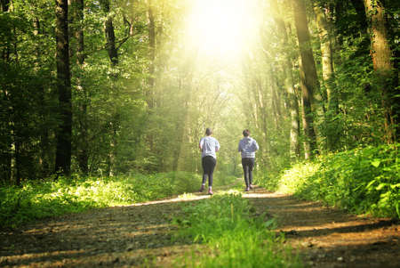 2 girls running through the park