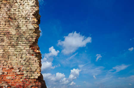 Old Brick Wall And Blue Skyの写真素材