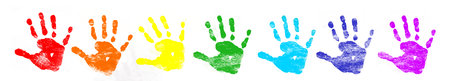 Collection of colorful child hand prints on white backgroundの写真素材