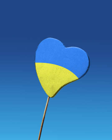 Pray for Ukraine sign, Ukraine flag in the shape of a heartの写真素材