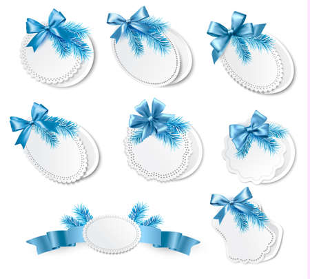 Set of christmas retro labels with  blue gift bows with ribbons. Vectorのイラスト素材