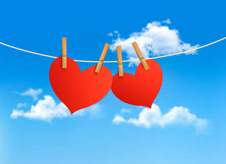 Two hearts hanging on a rope in front of a sky. Valentine's day vector. のイラスト素材