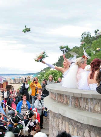 JURMALA - JUNE 13: 2nd annual wedding parade in resort city. Each year many brides from all country are participating in Bride parade - June 13, 2010 in Jurmala, Latvia.のeditorial素材