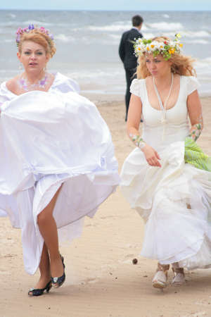 JURMALA - JUNE 13: 2nd annual wedding parade in resort city. Each year many brides from all country are participating in Bride parade - June 13, 2010 in Jurmala, Latvia.のeditorial素材