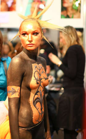 RIGA - APRIL 10: Model showcases of extravagant brides on the catwalk during Fiesta Expo 2011. Wedding and fashion show in hall of Kipsala - April 10, 2011 in Riga, Latvia.のeditorial素材