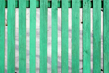 Scratched textured boards, light green wooden grunge background.の写真素材