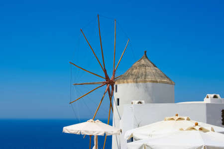 Windmill in Oia village on island of Santorini, Greeceの写真素材