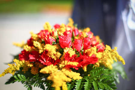 Wonderful wedding bouquet of beautiful colorful summer flowers.の写真素材