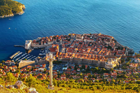 Amazing view from mountain at Old town of Dubrovnik in Croatia. Sunset in Adriatic sea, harbor with...