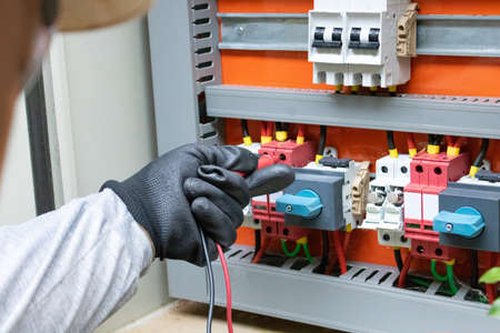 Cleaning and maintenance of the solar inverter. Solar energy concept image.